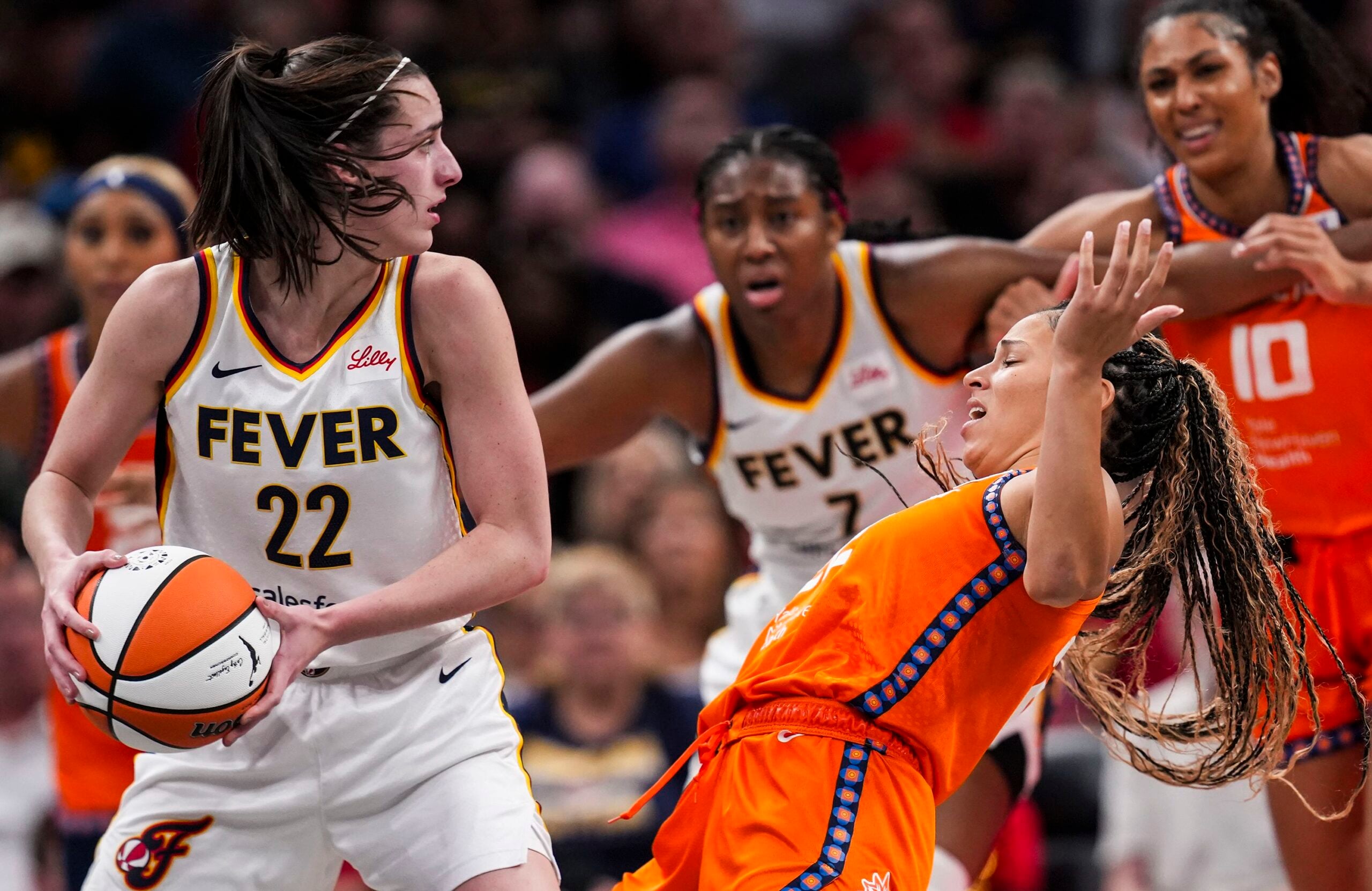 WNBA Player Caitlin Clark being blocked by another player