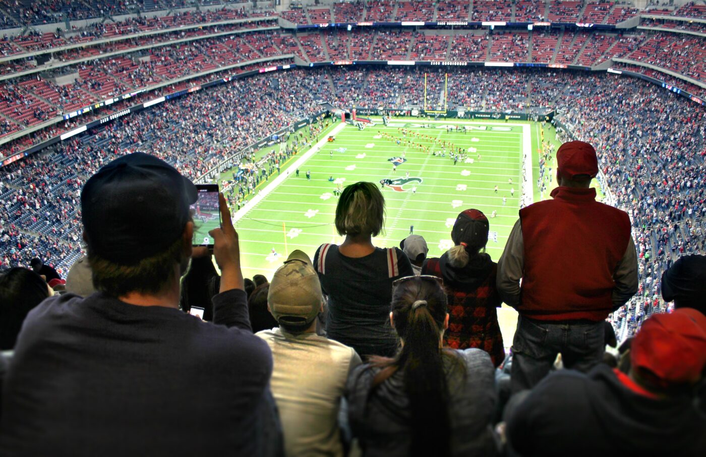 sports fans watching a live nfl football match